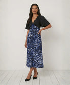 Blue leopard print satin midi dress with black V-neck bodice and flutter sleeves