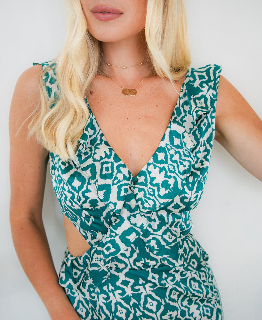 teal pattern dress with cutouts